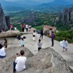 Meteora Rock with fantastic view and travelers